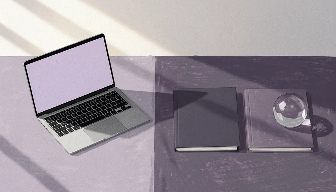 Illustrated laptop beside separate folders and a glass paperweight on a lavender desk